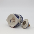 Ceramic container Gnome Christmas tree with lid A523 D108 – hand-painted Bolesławiec pottery in the shape of a gnome and Christmas tree, decorative and practical for storage.