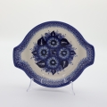 Hand decorated round baking dish with handles made from authentic Boleslawiec pottery.