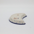 Unique Bolesławiec tray in crescent shape, perfect for serving snacks.