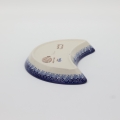 Hand-decorated Bolesławiec pottery – crescent tray, elegant table decoration.