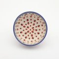 Boleslawiec ceramic bowl on table – traditional Polish pottery for everyday use.