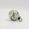 Ręcznie zdobiona karafka kula wykonana z tradycyjnej ceramiki bolesławieckiej. Oryginalna ceramiczna butelka idealna do serwowania nalewek, wody lub jako dekoracja stołu.