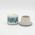Hand-painted water butter dish made from traditional Bolesławiec pottery. A practical kitchen accessory designed to keep butter fresh and spreadable longer.