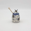 Hand-painted honey pot made from traditional Bolesławiec pottery. A stylish and practical container perfect for storing and serving honey.