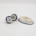 Hand-painted salt and pepper shakers with tray made from traditional Bolesławiec pottery. A stylish set perfect for everyday use and elegant table settings.