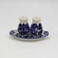 Hand-painted salt and pepper shakers with tray made from traditional Bolesławiec pottery. A stylish set perfect for everyday use and elegant table settings.