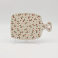 This versatile piece is a stylish alternative to wooden boards, offering superior durability and a timeless look. Featuring a convenient handle with a hanging hole, it doubles as a beautiful wall decoration when not in use.