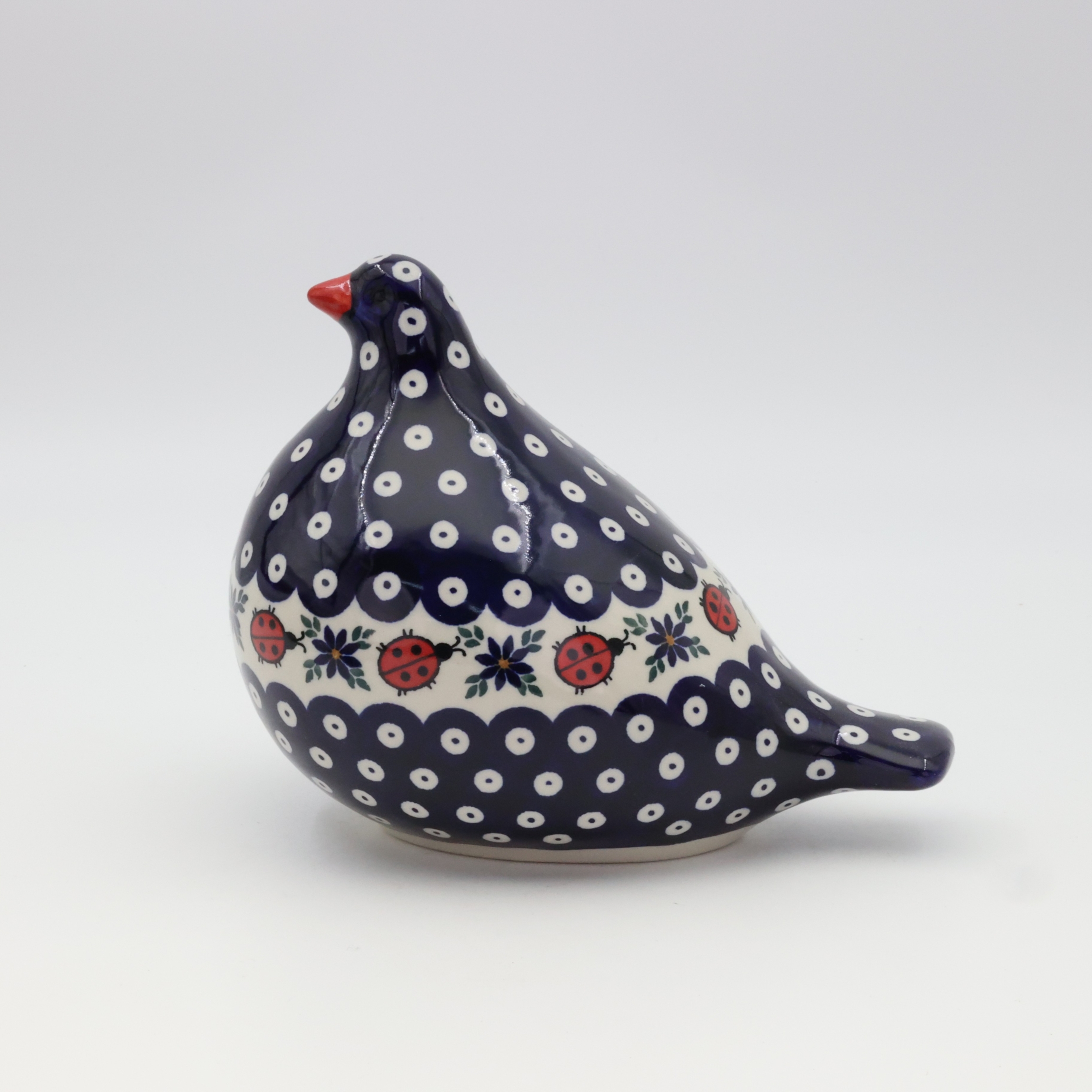 Hand-painted Bolesławiec ceramic pigeon figurine.