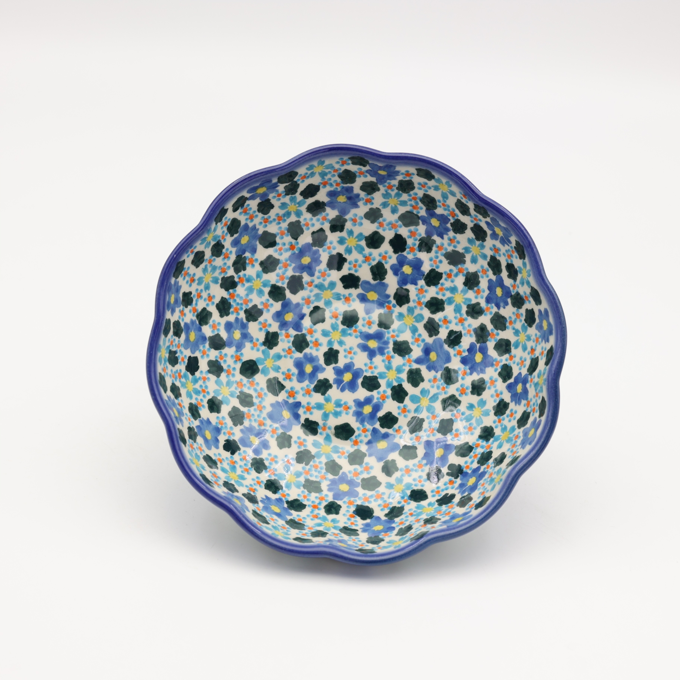 Each bowl is hand-formed and hand-decorated using traditional stamping techniques.